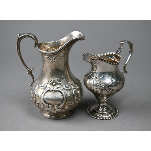 91 - A Victorian silver Rococo Revival pear-shaped cream jug with embossed scrolling decoration, Daniel &... 