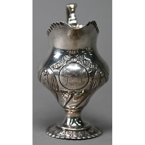 91 - A Victorian silver Rococo Revival pear-shaped cream jug with embossed scrolling decoration, Daniel &... 