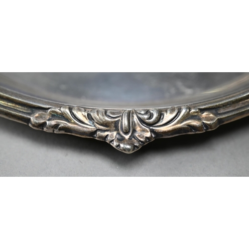 92 - A silver letter salver with scroll-embossed moulded rim, Robert Pringle & Sons, London 1918, 20.... 