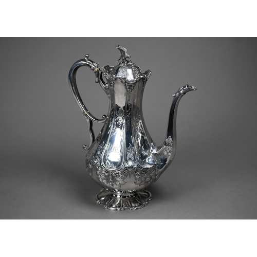 94 - A Victorian silver coffee pot with falcon finial and engraved decoration, the scroll handle with ivo... 