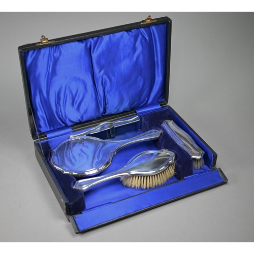 96 - A cased silver four-piece brush set, Charles S. Green & Co. Ltd, London 1915-17 (little used)