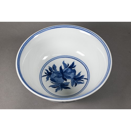 584 - A Chinese blue and white bowl painted with fruiting pomegranate sprays, the base with six-character ... 