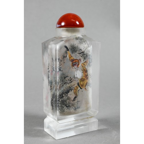 585 - A 20th century Chinese inside painted glass snuff bottle with orange glass stopper painted with Maca... 