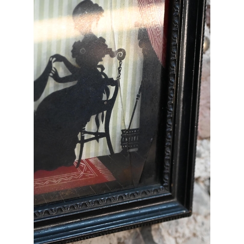 1019 - An early Victorian silhouette, reverse-painted under glass, family scene, 24 x 34 cm, framed (glass ... 