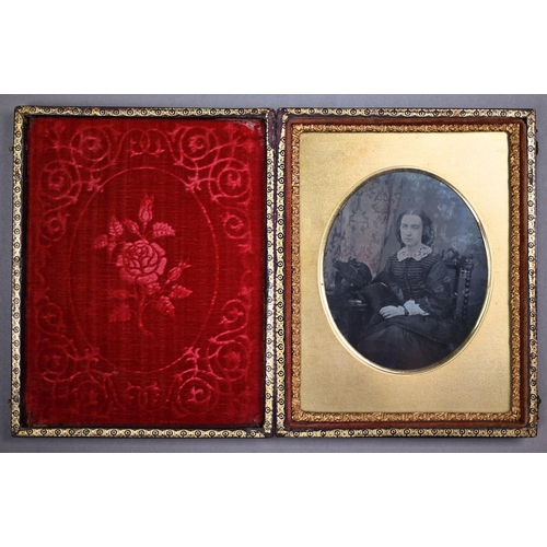 1021 - Four Ambrotype photographic portraits of ladies and a gentleman, in gilt mounts and leather pocket-c... 