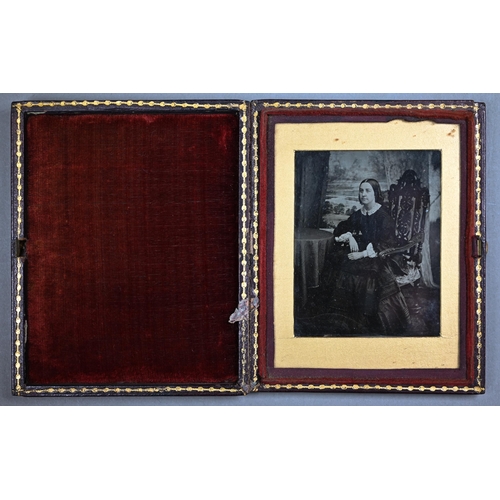 1021 - Four Ambrotype photographic portraits of ladies and a gentleman, in gilt mounts and leather pocket-c... 