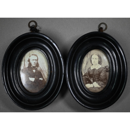 1021 - Four Ambrotype photographic portraits of ladies and a gentleman, in gilt mounts and leather pocket-c... 