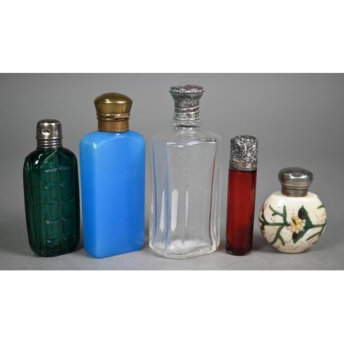 1082 - Two Victorian ruby glass double-ended scent bottles with unmarked white metal caps, a blue example a... 