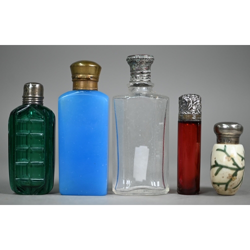 1082 - Two Victorian ruby glass double-ended scent bottles with unmarked white metal caps, a blue example a... 