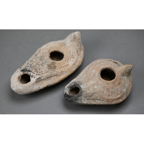 1094 - Three antiquity terracotta oil lamps to/w a later example and a reproduction metal lamp (5)