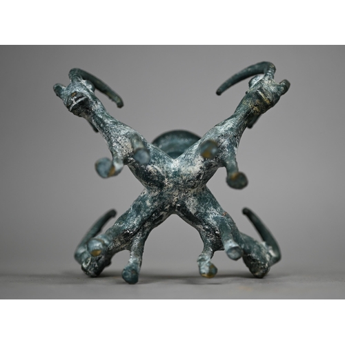 1099 - A verdigris-patinated candlestick supported by four goats, in the antique manner, 11 cm high