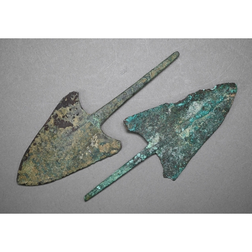 1100 - A Bronze Age dagger blade with shallow diamond section, 25 cm and a plainer 29 cm example, to/w a sp... 