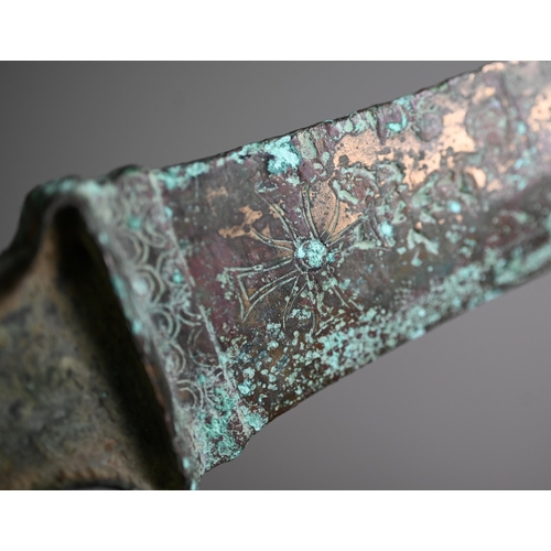 1103 - A Bronze Age (probably Iran) dagger, the tapering two-edge blade engraved with cruciform symbols and... 