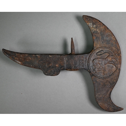 1106 - An antique iron ceremonial axe-head, the recurved blade cast with medallion of a mounted soldier, th... 