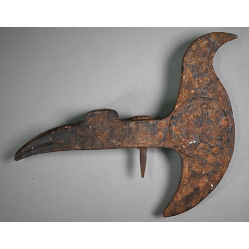 1106 - An antique iron ceremonial axe-head, the recurved blade cast with medallion of a mounted soldier, th... 