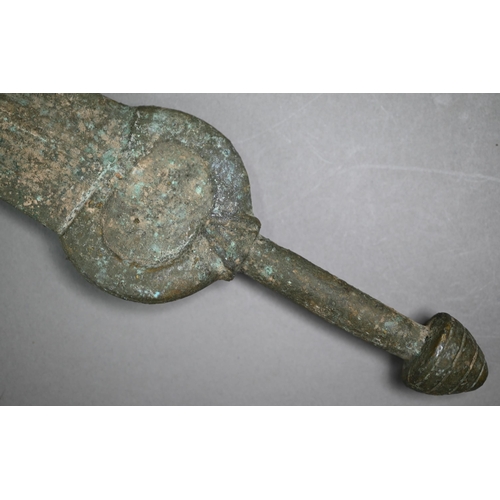 1107 - A Bronze Age sword, the tapering fullered blade with midrib, extending from oval shoulder, with colu... 