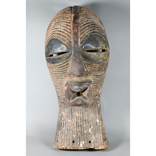 1114 - A West African carved wood Songye mask (Kifwebe) Democratic Republic of Congo, with incised linear d... 