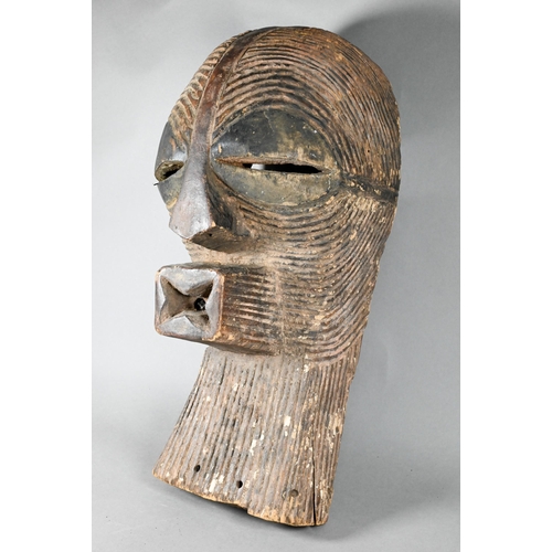 1114 - A West African carved wood Songye mask (Kifwebe) Democratic Republic of Congo, with incised linear d... 