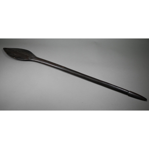 1118 - An antique Polynesian carved wood throwing club, the paddle-shaped head with raised midrib and with ... 