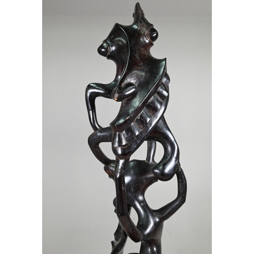 1122 - Three African figural carvings, 79-35 cm