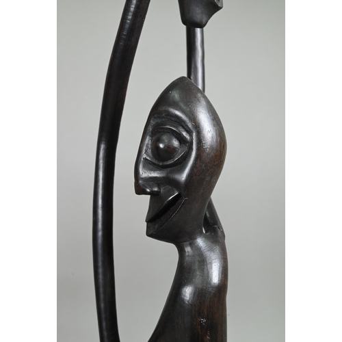 1122 - Three African figural carvings, 79-35 cm