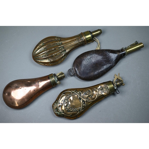 1124 - Two 19th century ornate copper and brass powder/shot flasks to/w a plain example and a leather shot-... 