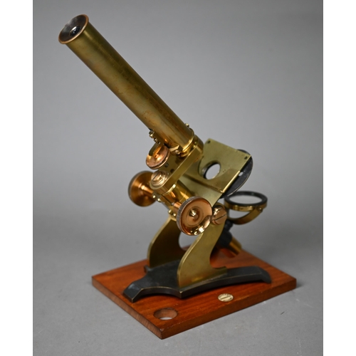 1130 - A vintage brass travelling microscope in box, with detachable platform lenses, slides etc by Franks ... 