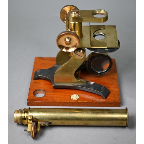 1130 - A vintage brass travelling microscope in box, with detachable platform lenses, slides etc by Franks ... 