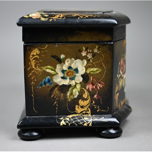 1138 - A Victorian lacquered papier maché tea caddy painted and gilded overall with flowers, on bun feet, w... 