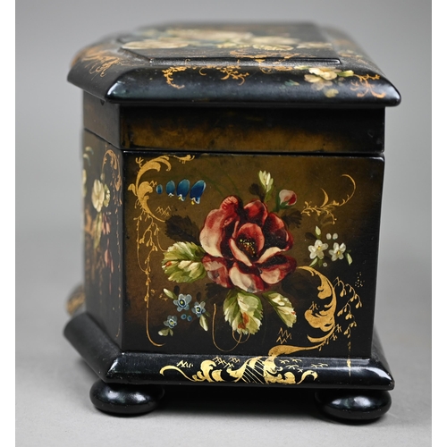 1138 - A Victorian lacquered papier maché tea caddy painted and gilded overall with flowers, on bun feet, w... 