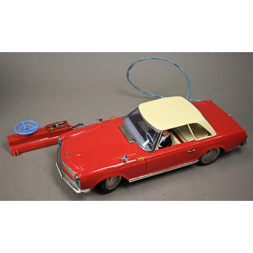 1153 - A boxed Yanoman (Japan) tinplate Mercedes Benz 230SL with remote control - battery operated, 38 cm l... 