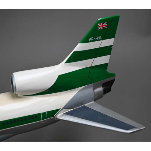 1175 - A painted wood model of a comercial air-liner with Cathay Pacific livery 55 cm long, on wire stand