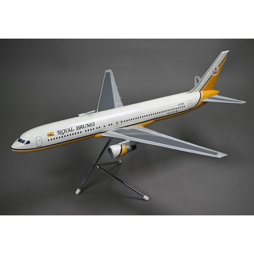 1176 - A painted wood model of a commercial air-liner in Royal Brunei livery 55 cm long on wire stand