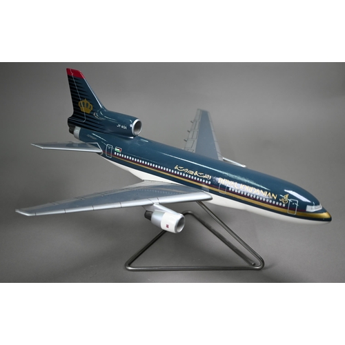 1177 - A painted wood model of a commercial air-liner with Royal Jordanian livery, 50 cm long on wire stand