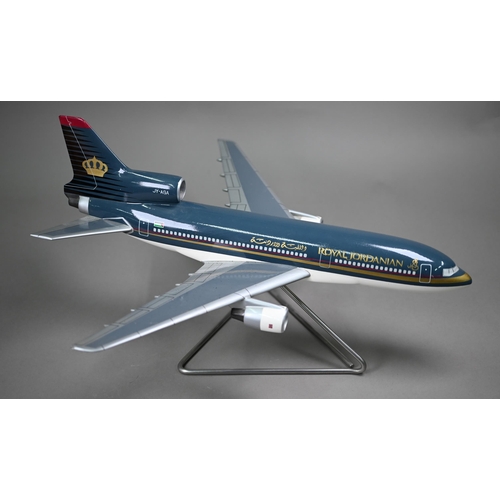 1177 - A painted wood model of a commercial air-liner with Royal Jordanian livery, 50 cm long on wire stand