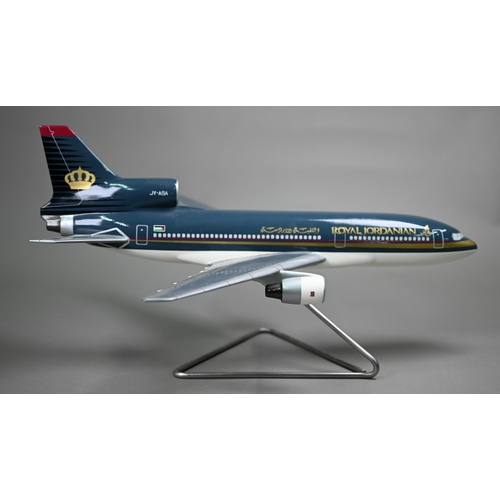 1177 - A painted wood model of a commercial air-liner with Royal Jordanian livery, 50 cm long on wire stand