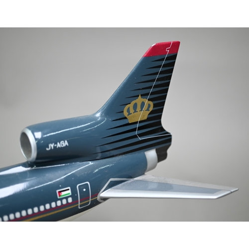 1177 - A painted wood model of a commercial air-liner with Royal Jordanian livery, 50 cm long on wire stand