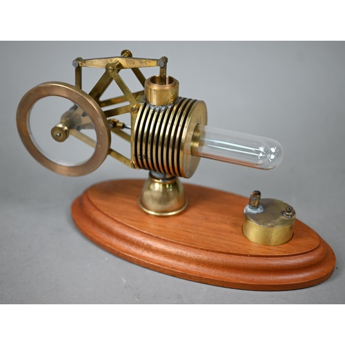 1185 - Two brass and glass model Stirling engines 33/25 cm wide to/w an oil can/burner (3)