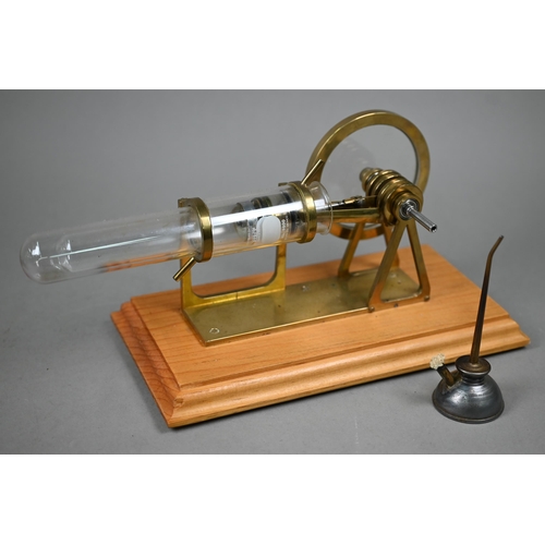 1185 - Two brass and glass model Stirling engines 33/25 cm wide to/w an oil can/burner (3)