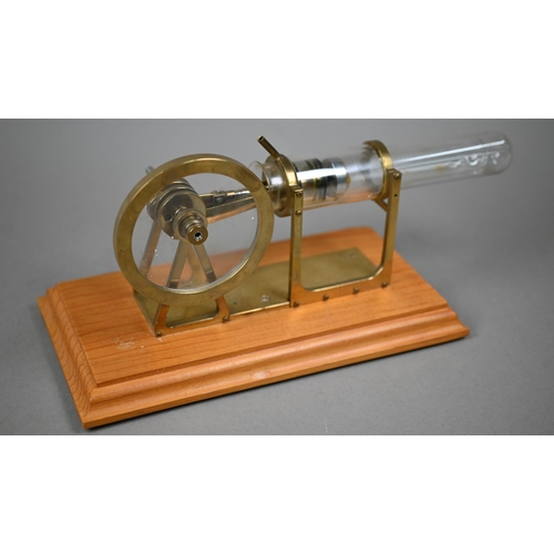 1185 - Two brass and glass model Stirling engines 33/25 cm wide to/w an oil can/burner (3)