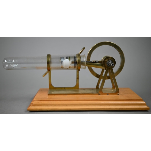 1185 - Two brass and glass model Stirling engines 33/25 cm wide to/w an oil can/burner (3)