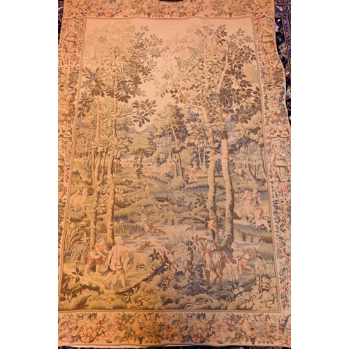 1202 - A vintage Renaissance style tapestry wall-hanging, centred by a deer-stalking party in a pastoral va... 