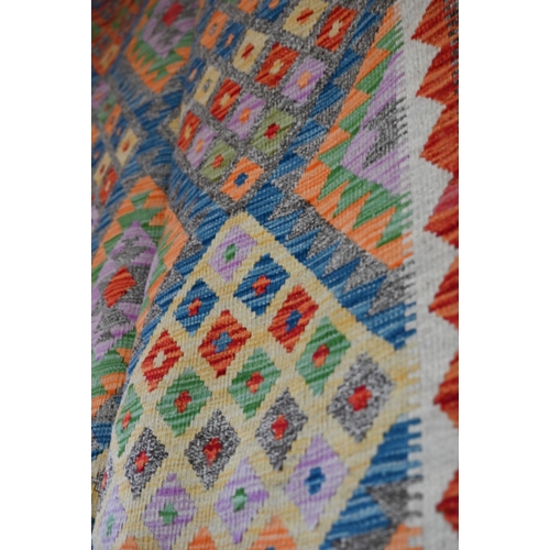 1212 - A contemporary Turkish Anatolian multi-coloured geometric design Kelim carpet, 301 x 207 cm