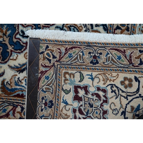 1215 - A Central Persian part silk Nain carpet with mid-blue ground centred by radiating floral medallion, ... 