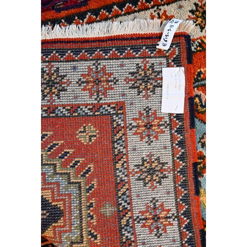 1218 - A contemporary Indo-Persian Kazak runner, burnt orange ground with five alternating lozenge design, ... 