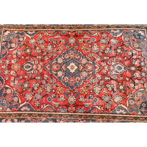 1225 - An Old Persian Hamadan rug, predominantly pearl red and ink blue floral design, 182 x 131 cm