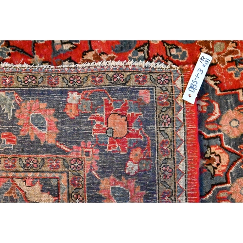 1225 - An Old Persian Hamadan rug, predominantly pearl red and ink blue floral design, 182 x 131 cm