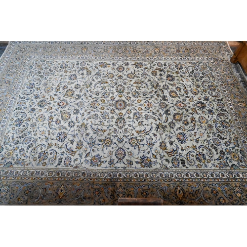 A Central Persian signed Kashan carpet, pale celadon ground with well-executed floral vine design, 430 x 312 cm