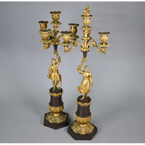 1260 - A pair of continental bronzed and ormolu four-sconce candelabra with figural pillars, 59 cm high o/a... 