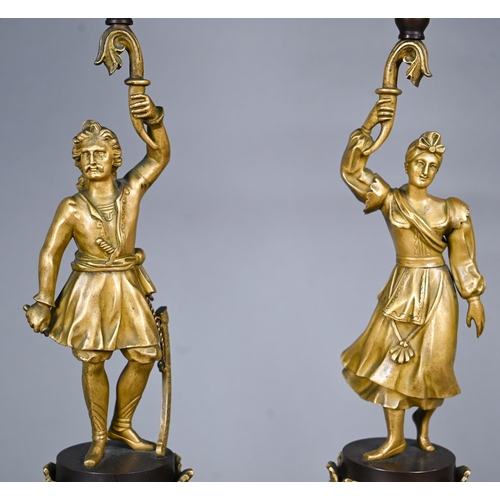 1260 - A pair of continental bronzed and ormolu four-sconce candelabra with figural pillars, 59 cm high o/a... 